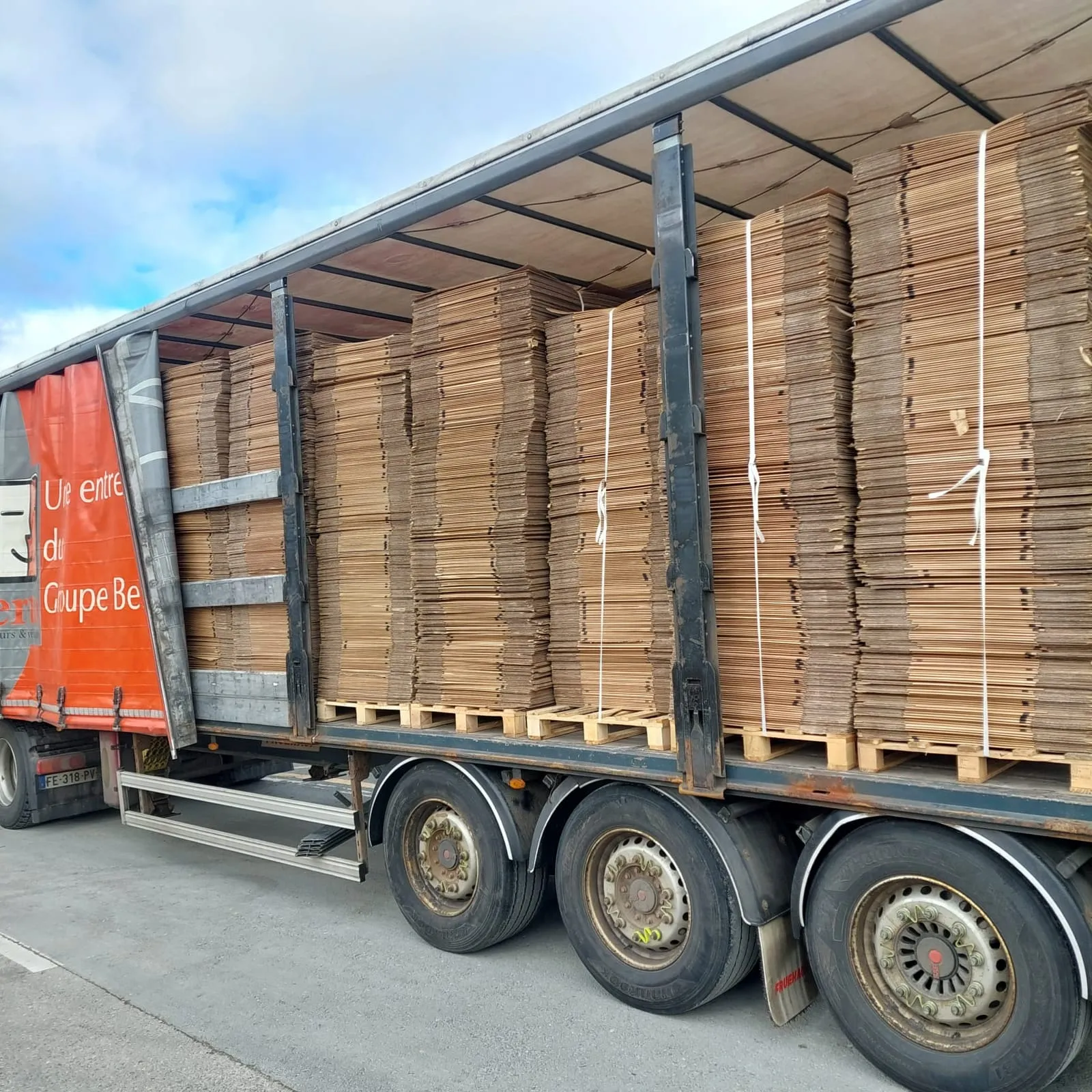 Pallets of cardboard prepared for reuse, loaded in a truck